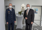 Innenminister Herrmann vor Fotos der getöteten Polizisten
