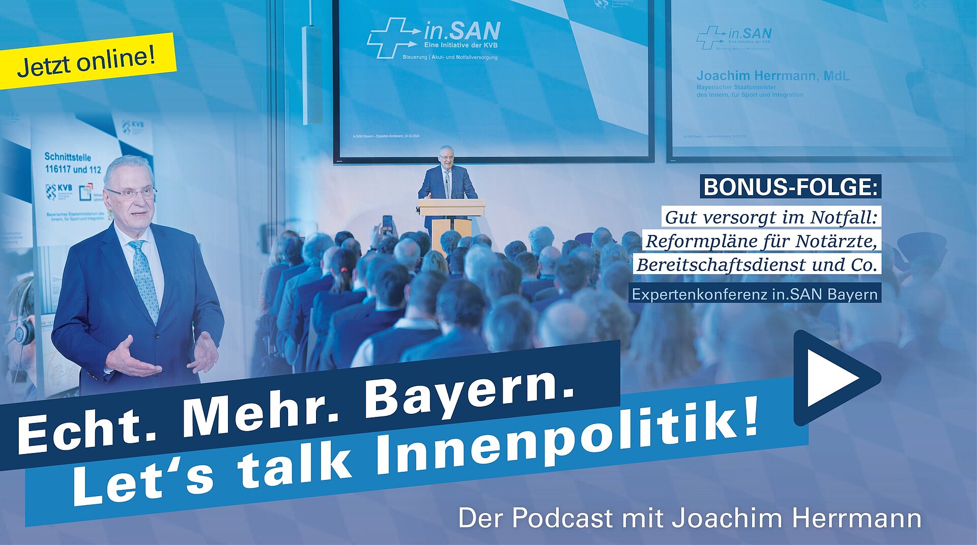 Innenminister Joachim Herrmann spricht vor Publikum, er steht auf einem Podium hinter einem Rednerpult